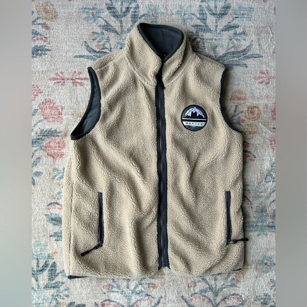 Notice the Reckless fleece vest